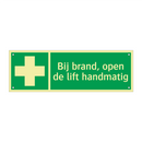 Bij brand, open de lift handmatig & Bij brand, open de lift handmatig