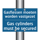 Gasflessen moeten worden vastgezet /.../ - Gas cylinders must be secured