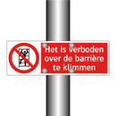 Het is verboden over de barrière te klimmen