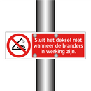 Sluit het deksel niet wanneer de branders in werking zijn.