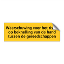 Waarschuwing voor het risico op beknelling van de hand /.../