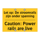 Let op: De stroomrails zijn onder spanning - Caution: Power rails are live