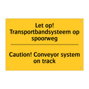 Let op! Transportbandsysteem op spoorweg - Caution! Conveyor system on track