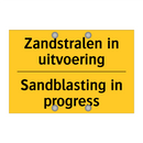 Zandstralen in uitvoering - Sandblasting in progress