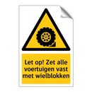 Let op! Zet alle voertuigen vast met wielblokken