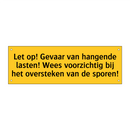 Let op! Gevaar van hangende lasten! Wees voorzichtig /.../