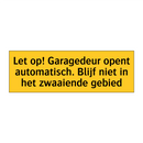 Let op! Garagedeur opent automatisch. Blijf niet in /.../