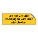 Let op! Zet alle voertuigen vast met wielblokken & Let op! Zet alle voertuigen vast met wielblokken
